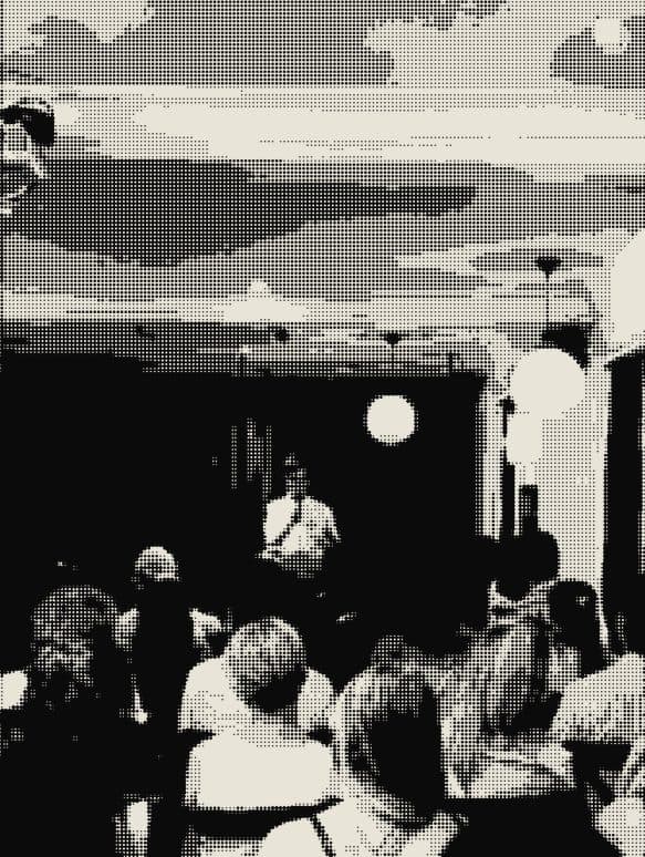 The audience in front of a red curtain