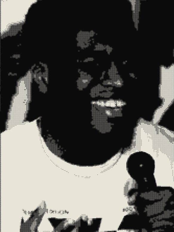 A performer laughing into the mic